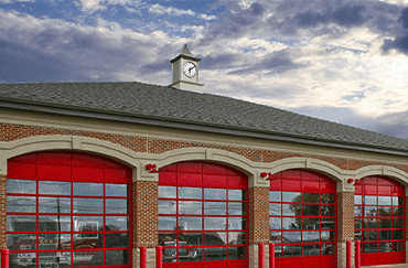 red roll-up commercial glass garage doors